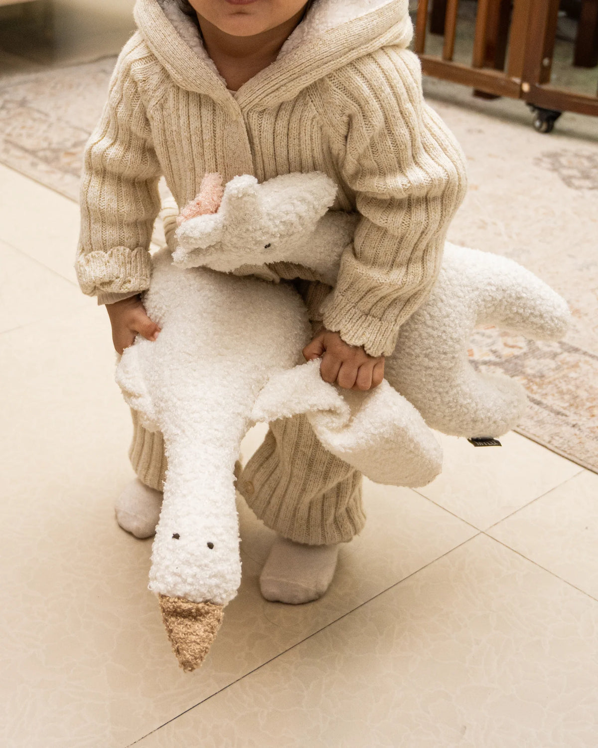 White and beige bouclé goose cushion by MYLU, a personalised newborn gift
