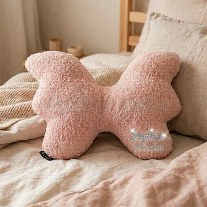 Blush Butterfly cushion personalised with a baby's name in Silver Shimmer lettering