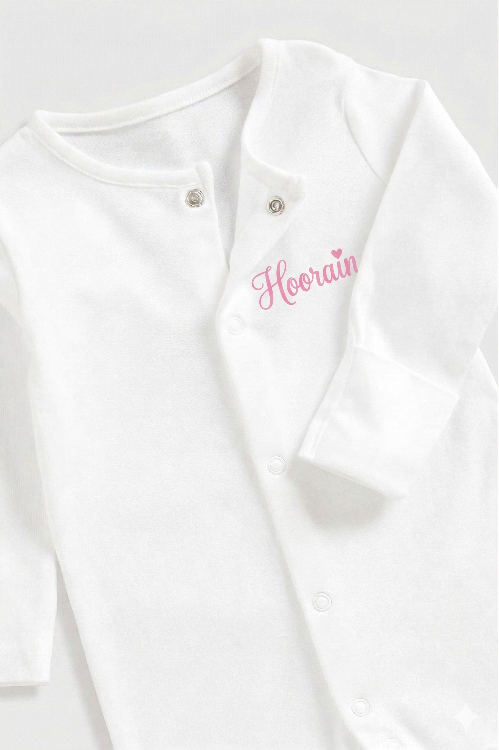 Personalised baby onesie with custom name on soft cotton fabric, ideal keepsake gift for newborns
