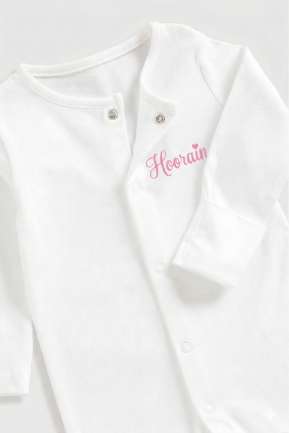 Personalised baby onesie with custom name on soft cotton fabric, ideal keepsake gift for newborns