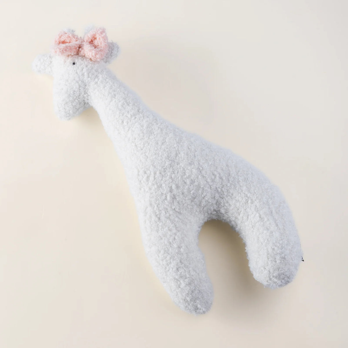 Handmade MYLU giraffe cushion with pink bow, personalised nursery keepsake