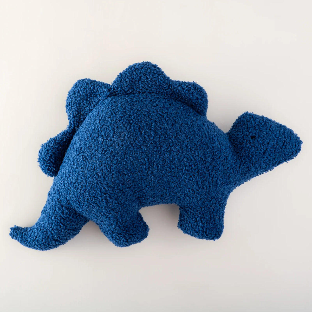 Blue bouclé dinosaur cushion by MYLU, personalised kids' room décor