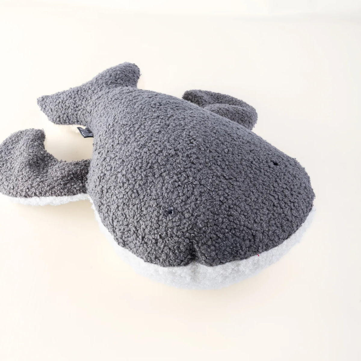 Handmade grey bouclé whale cushion by MYLU, a personalised newborn gift